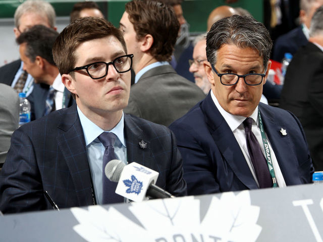 DALLAS, TX - JUNE 23: (l-r) Kyle Dubas and Brendan Shanahan of the Toronto Maple Leafs handle the draft table during the 2018 NHL Draft at American Airlines Center on June 23, 2018 in Dallas, Texas.