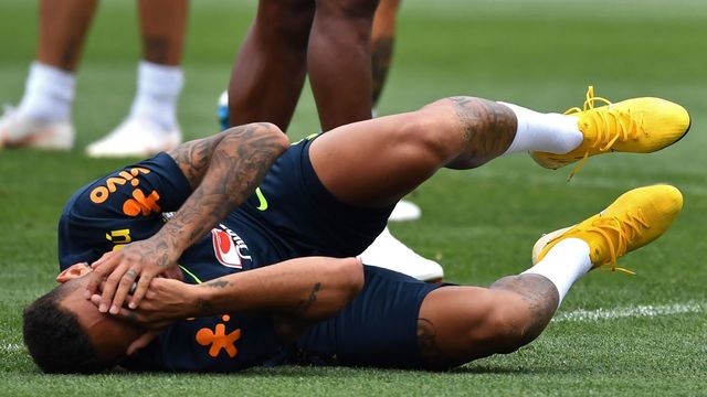 Brazil's forward Neymar gestures as he lies on the ground during a training session at Yug Sport Stadium, in Sochi, on July 4, 2018, during the Russia 2018 World Cup football tournament.