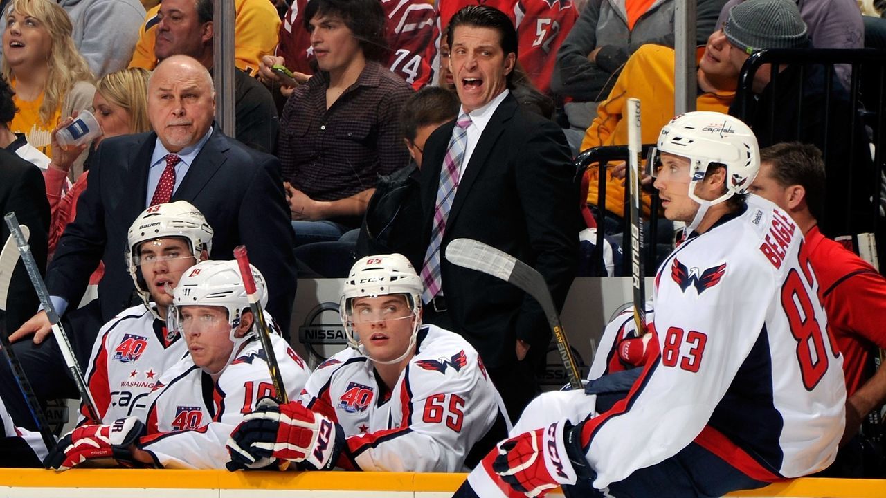 NASHVILLE, TN - JANUARY 16: Head coach Barry Trotz and assistant coach Lane Lambert of the Washington Capitals reacts during a game against the Nashville Predators during the second period at Bridgestone Arena on January 16, 2015 in Nashville, Tennessee.