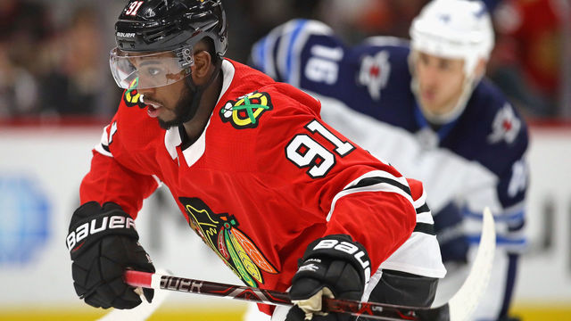 CHICAGO, IL - JANUARY 12: Anthony Duclair #91 of the Chicago Blackhawks skates to the puck after a faceoff against the Winnipeg Jets at the United Center on January 12, 2018 in Chicago, Illinois. The Blackhawks defeated the Jets 2-1.