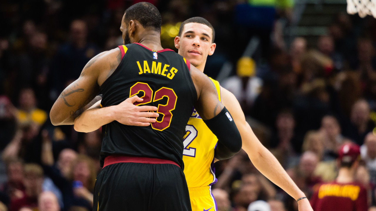 CLEVELAND, OH - DECEMBER 14: LeBron James #23 of the Cleveland Cavaliers and Lonzo Ball #2 of the Los Angeles Lakers embrace during the first half at Quicken Loans Arena on December 14, 2017 in Cleveland, Ohio.