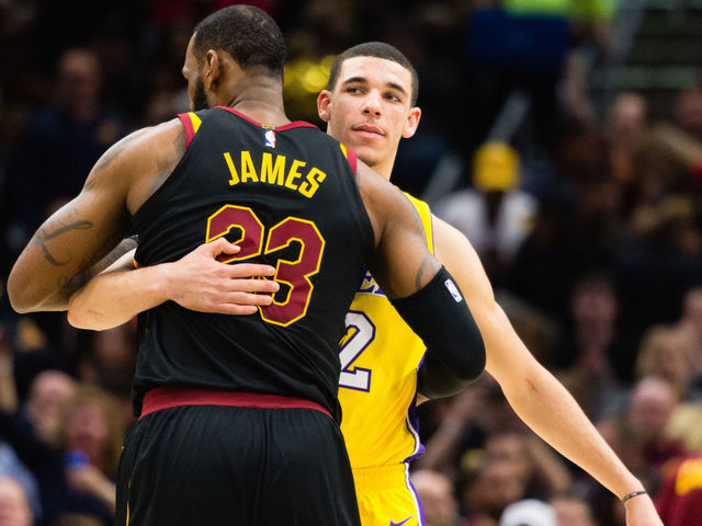 CLEVELAND, OH - DECEMBER 14: LeBron James #23 of the Cleveland Cavaliers and Lonzo Ball #2 of the Los Angeles Lakers embrace during the first half at Quicken Loans Arena on December 14, 2017 in Cleveland, Ohio.