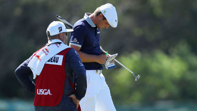 SOUTHAMPTON, NY - JUNE 14: Bryson DeChambeau of the United States waits on the fifth green with his caddie during the first round of the 2018 U.S. Open at Shinnecock Hills Golf Club on June 14, 2018 in Southampton, New York.