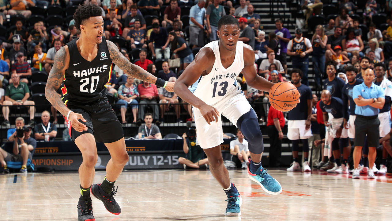SALT LAKE CITY - JULY 2: Jaren Jackson Jr. #13 of the handles the ball against Jason Collins #20 of the Atlanta Hawks during the 2018 Summer League at the Vivint Smart Home Arena on July 2, 2018 in Salt Lake CIty, Utah. Mandatory Copyright Notice: Copyright 2018 NBAE