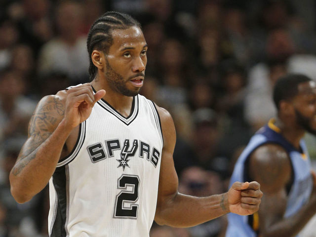 SAN ANTONIO,TX - APRIL 17 : Kawhi Leonard #2 of the San Antonio Spurs reacts after a basket against the Memphis Grizzlies in Game Two of the Western Conference Quarterfinals during the 2017 NBA Playoffs at AT&T Center on April 17, 2017 in San Antonio, Texas. NOTE TO USER: User expressly acknowledges and agrees that , by downloading and or using this photograph, User is consenting to the terms and conditions of the Getty Images License Agreement.