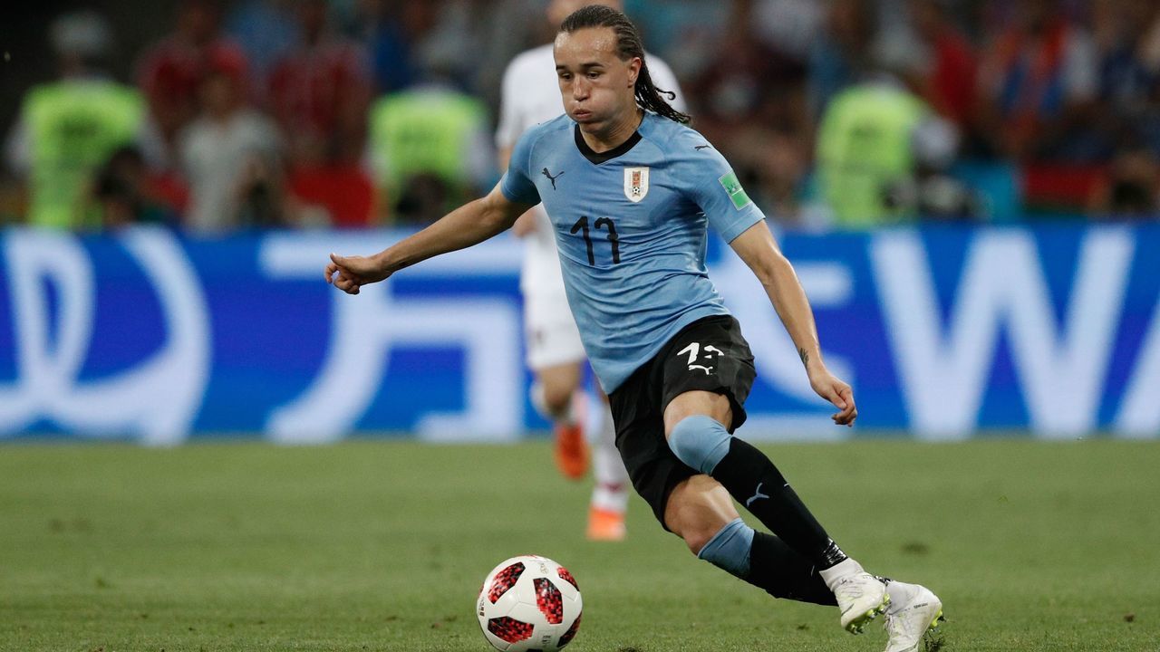 Uruguay's defender Diego Laxalt runs with the ball during the Russia 2018 World Cup round of 16 football match between Uruguay and Portugal at the Fisht Stadium in Sochi on June 30, 2018.