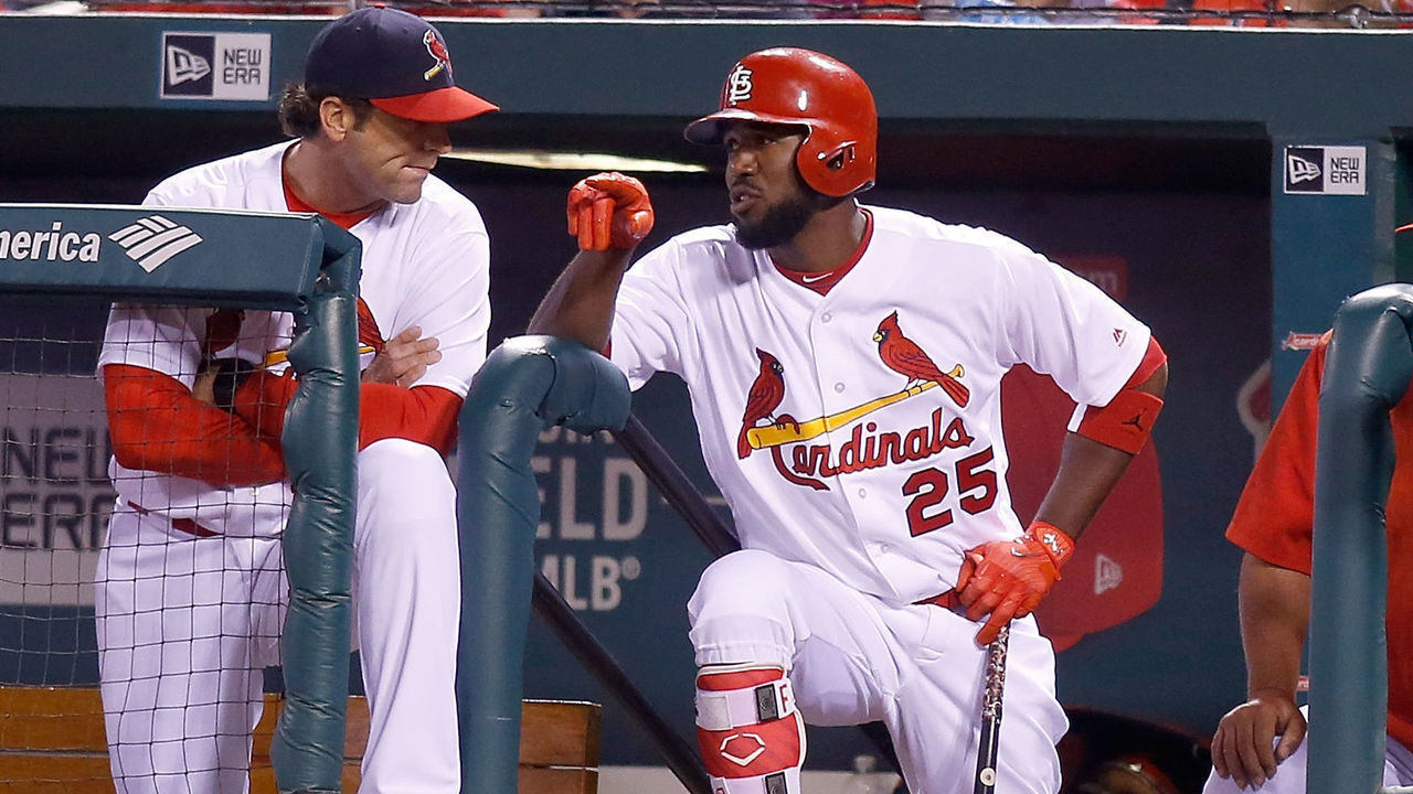 ST. LOUIS, MO - APRIL 02: St. Louis Cardinals center fielder Dexter Fowler (25) talks with manager Mike Matheny (22) during a baseball game against the Chicago Cubs on April 2, 2017, at Busch Stadium in St. Louis, Missouri.