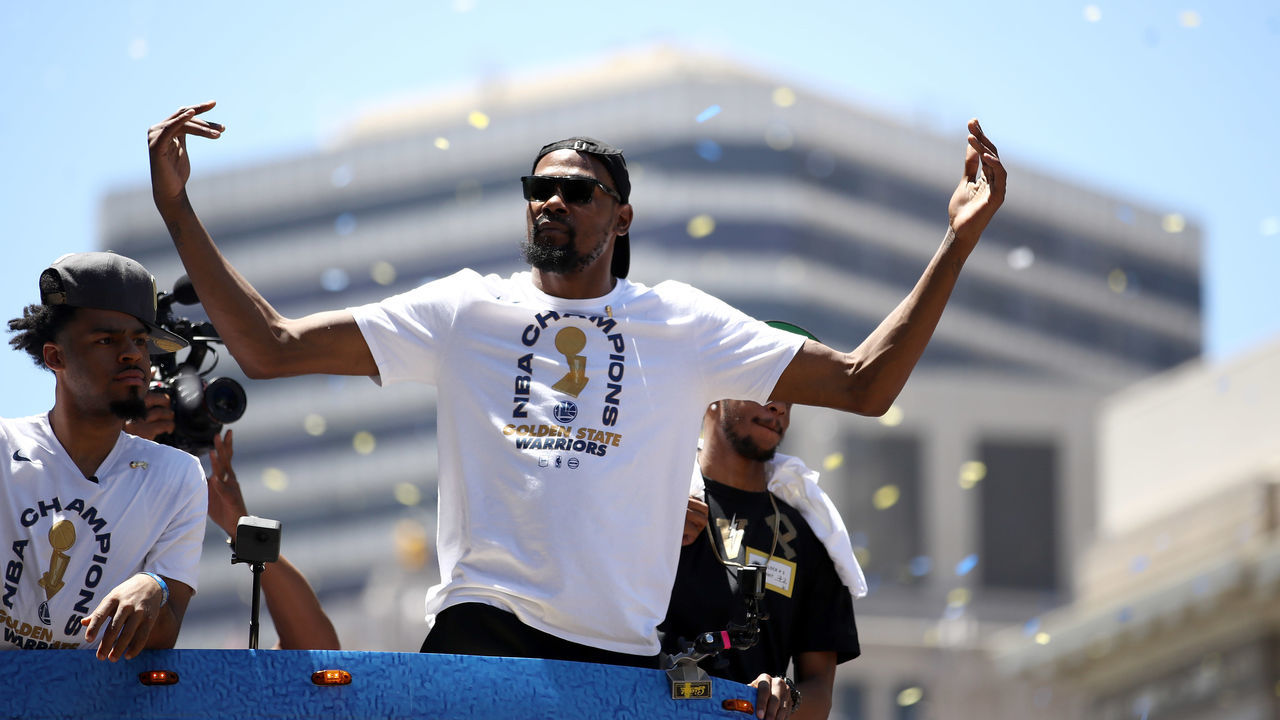 OAKLAND, CA - JUNE 12: Kevin Durant #35 of the Golden State Warriors gestures to the crowd during the Golden State Warriors Victory Parade on June 12, 2018 in Oakland, California. The Golden State Warriors beat the Cleveland Cavaliers 4-0 to win the 2018 NBA Finals.