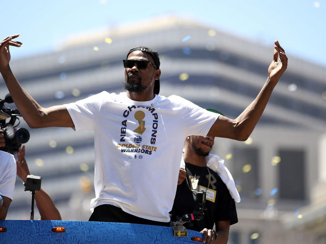 OAKLAND, CA - JUNE 12: Kevin Durant #35 of the Golden State Warriors gestures to the crowd during the Golden State Warriors Victory Parade on June 12, 2018 in Oakland, California. The Golden State Warriors beat the Cleveland Cavaliers 4-0 to win the 2018 NBA Finals.