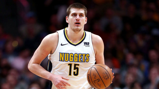 DENVER, CO - APRIL 03: Nikola Jokic #15 of the Denver Nuggets brings the ball down the court against the Indiana Pacers at the Pepsi Center on April 3, 2018 in Denver, Colorado.