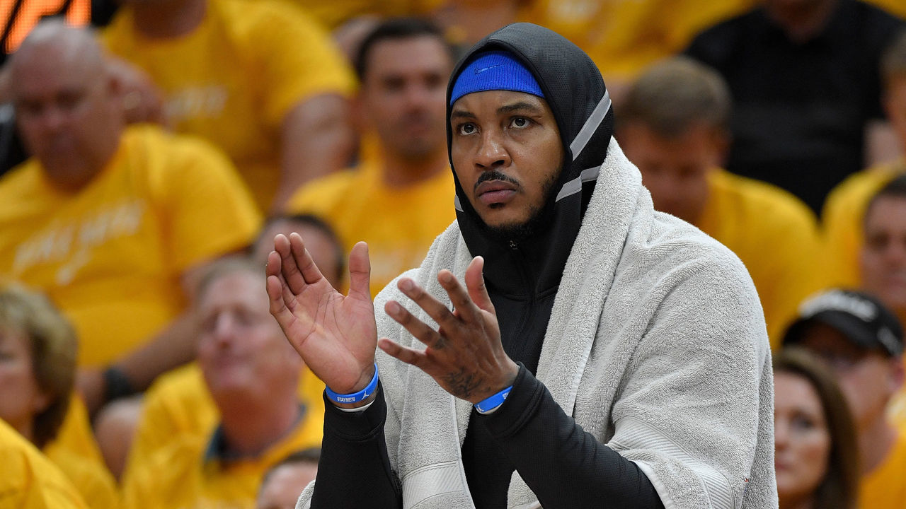 SALT LAKE CITY, UT - APRIL 21: Carmelo Anthony #7 of the Oklahoma City Thunder cheers from the bench in the first half during Game Three of Round One of the 2018 NBA Playoffs against the Utah Jazz at Vivint Smart Home Arena on April 21, 2018 in Salt Lake City, Utah.