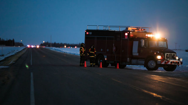 An emergency vehicle is seen near the crash site on April 6, 2018 after a bus carrying a junior ice hockey team collided with a semi-trailer truck between Tisdale and Nipawin, Saskatchewan province, killing 14 people. - Hockey-mad Canada was in mourning on Saturday after a bus carrying a junior ice hockey team collided with a semi-trailer truck in Saskatchewan province, killing 14 people.In a country where love of the sport is almost a religion, the crash sparked an outpouring of grief among players and fans on social media, while national political leaders expressed their sympathies.'We can now confirm 14 people have died as a result of this collision,' the Royal Canadian Mounted Police said in a statement, which did not say how many of the victims were players or coaches of the Humboldt Broncos team.