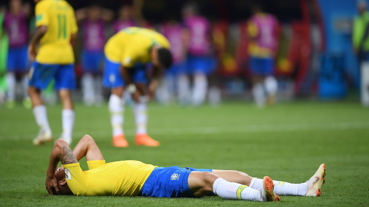 KAZAN, RUSSIA - JULY 06: Renato Augusto of Brazil lies on the pitch injured during the 2018 FIFA World Cup Russia Quarter Final match between Brazil and Belgium at Kazan Arena on July 6, 2018 in Kazan, Russia.