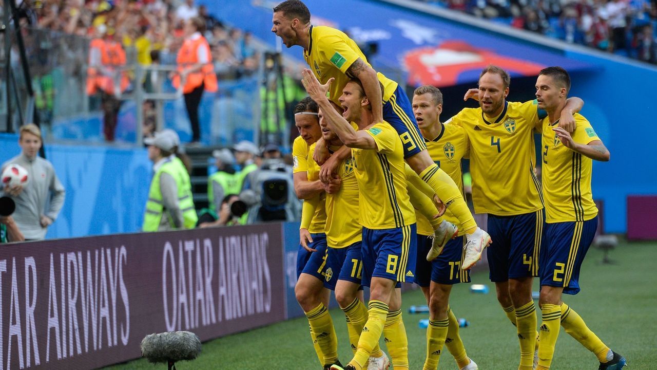 TOPSHOT - Sweden's players celebrate after midfielder Emil Forsberg scored during the Russia 2018 World Cup round of 16 football match between Sweden and Switzerland at the Saint Petersburg Stadium in Saint Petersburg on July 3, 2018.