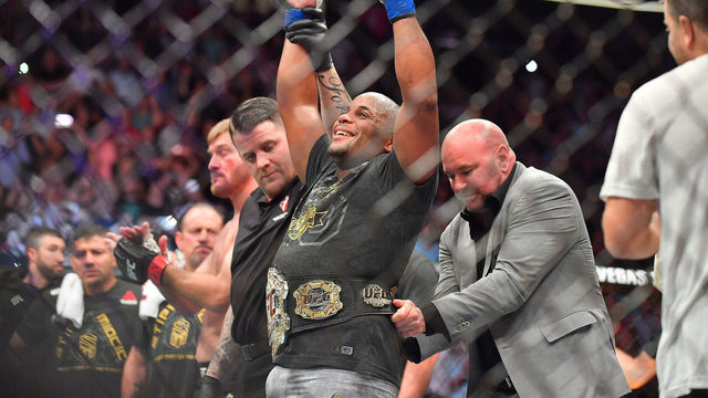 LAS VEGAS, NV - JULY 07: UFC President Dana White (R) places the championship belt around the waist of Daniel Cormier after he defeated Stipe Miocic in their heavyweight championship fight at T-Mobile Arena on July 7, 2018 in Las Vegas, Nevada. Cormier won by first round knockout.