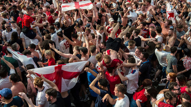 LONDON, ENGLAND - JULY 07: England football fans celebrate at the end of the match after England win in the England V Sweden quater final match in the FIFA 2018 World Cup Finals at Croydon Boxpark on July 7, 2018 in London, England. World Cup fever is building among England fans after reaching the quater finals in Russia.