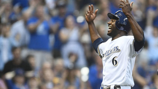 MILWAUKEE, WI - JUNE 12: Lorenzo Cain #6 of the Milwaukee Brewers celebrates after scoring a run during the third inning of a game against the Chicago Cubs at Miller Park on June 12, 2018 in Milwaukee, Wisconsin.
