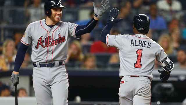 NEW YORK, NY - JULY 03: Ozzie Albies #1 of the Atlanta Braves celebrates with Freddie Freeman #5 after Albies' solo home run in the fifth inning against the New York Yankees at Yankee Stadium on July 3, 2018 in the Bronx borough of New York City.
