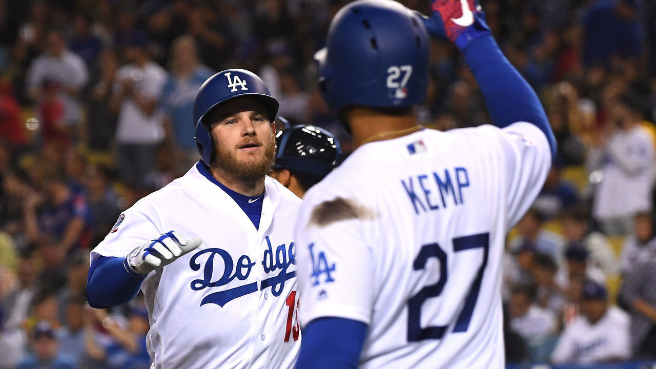 LOS ANGELES, CA - JUNE 08: Max Muncy #13 gets a high five from Matt Kemp #27 of the Los Angeles Dodgers after hitting a solo home run in the fifth fifth inning of the game at Dodger Stadium on June 8, 2018 in Los Angeles, California.