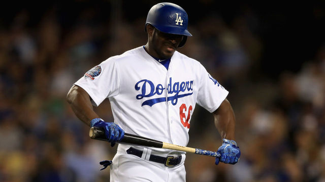 LOS ANGELES, CA - JUNE 26: Yasiel Puig #66 of the Los Angeles Dodgers walks back to the dugout after striking out during the fifth inning of a game against the Chicago Cubs at Dodger Stadium on June 26, 2018 in Los Angeles, California.