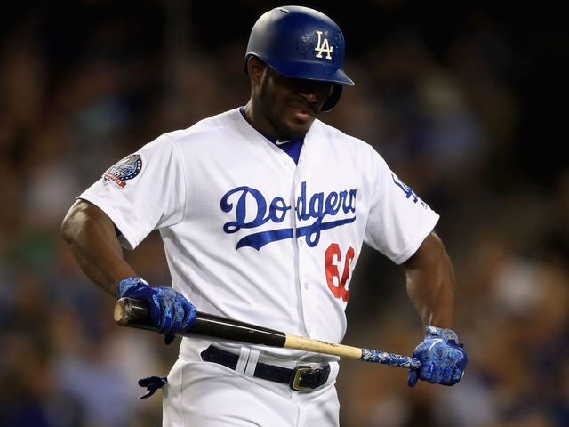 LOS ANGELES, CA - JUNE 26: Yasiel Puig #66 of the Los Angeles Dodgers walks back to the dugout after striking out during the fifth inning of a game against the Chicago Cubs at Dodger Stadium on June 26, 2018 in Los Angeles, California.
