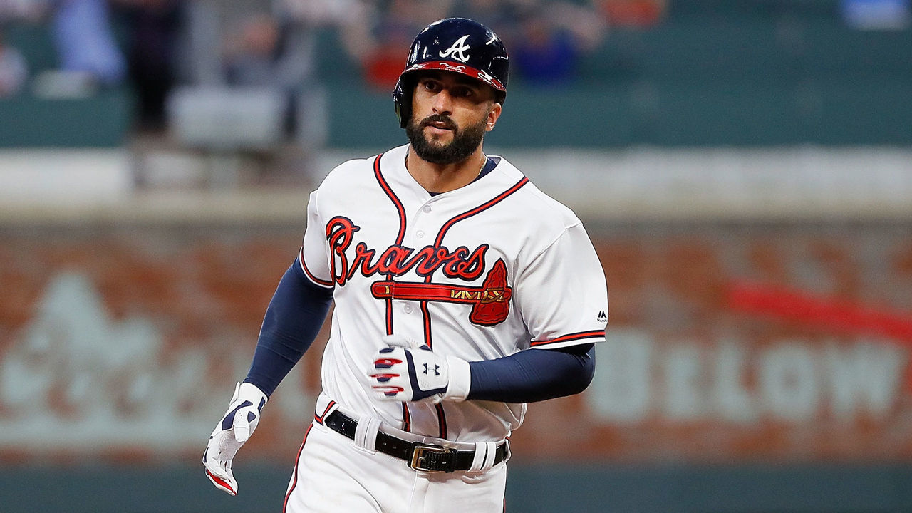 ATLANTA, GA - MARCH 29: Nick Markakis #22 of the Atlanta Braves celebrates trotts to third base after hitting a three-run homer in the ninth inning for a 8-5 win over the Philadelphia Phillies at SunTrust Park on March 29, 2018 in Atlanta, Georgia.
