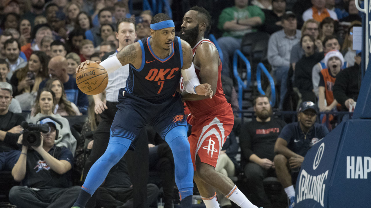 OKLAHOMA CITY, OK - DECEMBER 25: James Harden #13 of the Houston Rockets blocks Carmelo Anthony #7 of the Oklahoma City Thunder during the second half of a NBA game at the Chesapeake Energy Arena on December 25, 2017 in Oklahoma City, Oklahoma. The Thunder defeated the Rockets 112-107.