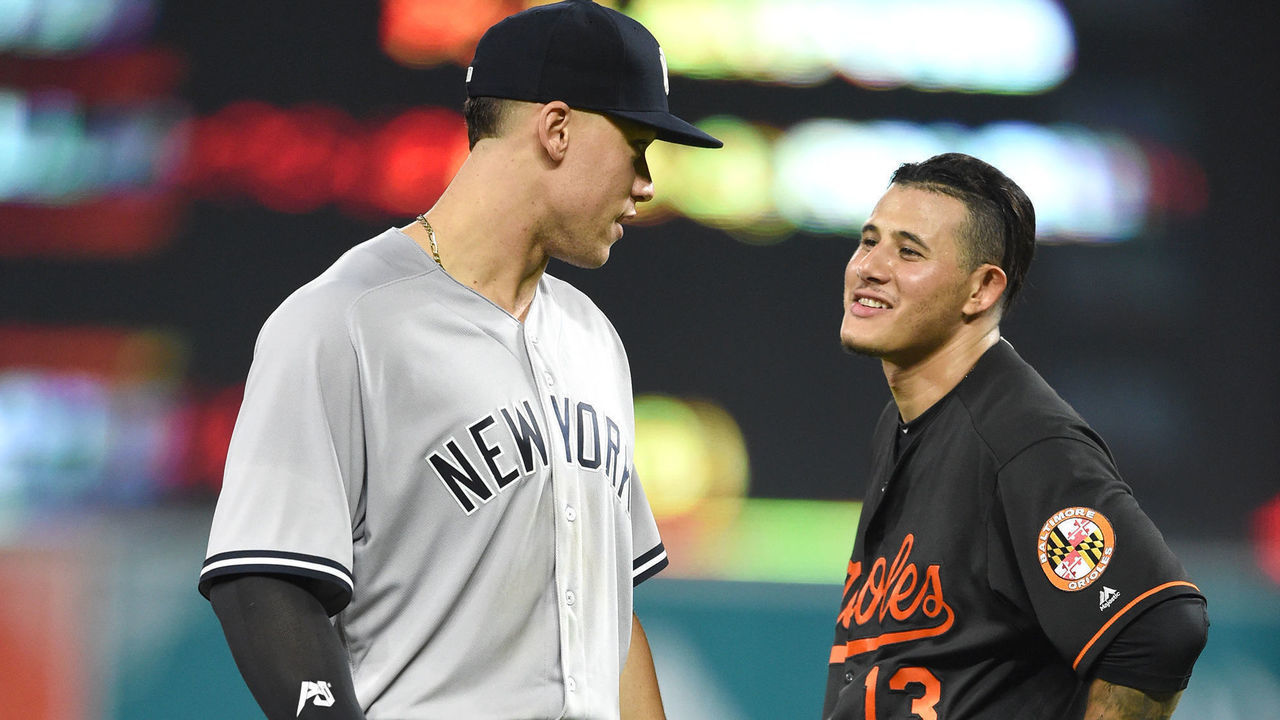 BALTIMORE, MD - JUNE 01: Aaron Judge #99 of the New York Yankees and Manny Machado #13 of the Baltimore Orioles talk between inning pitches during a baseball game at Oriole Park at Camden Yards on June 1, 2018 in Baltimore, Maryland.