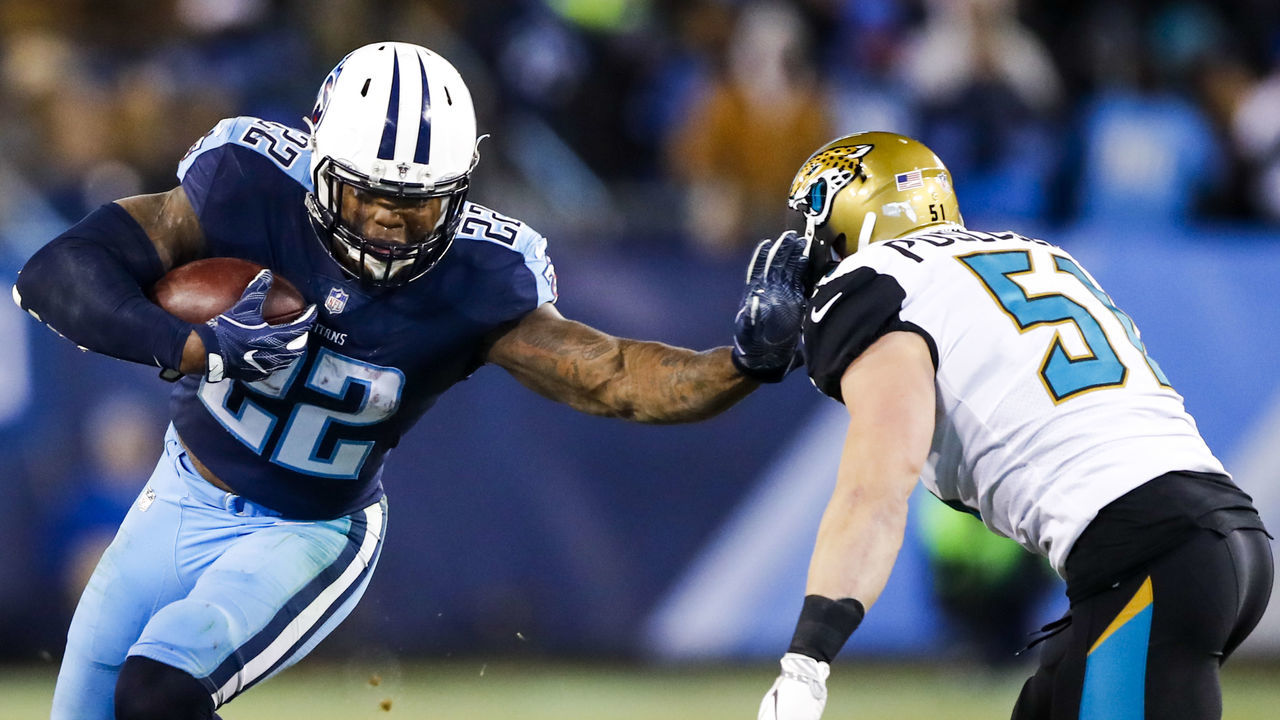 NASHVILLE, TN - DECEMBER 31: Running Back Derrick Henry #22 of the Tennessee Titans stiff arms Linebacker Paul Posluszny #51 of the Jacksonville Jaguars at Nissan Stadium on December 31, 2017 in Nashville, Tennessee.