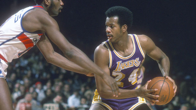 LANDOVER, MD - CIRCA 1976: Kermit Washington #24 of the Los Angeles Lakers looks to put a move on Elvin Hayes #11 of the Washington Bullets during an NBA basketball game circa 1976 at the Capital Centre in Landover, Maryland. Washington played for the Lakers from 1973-77.