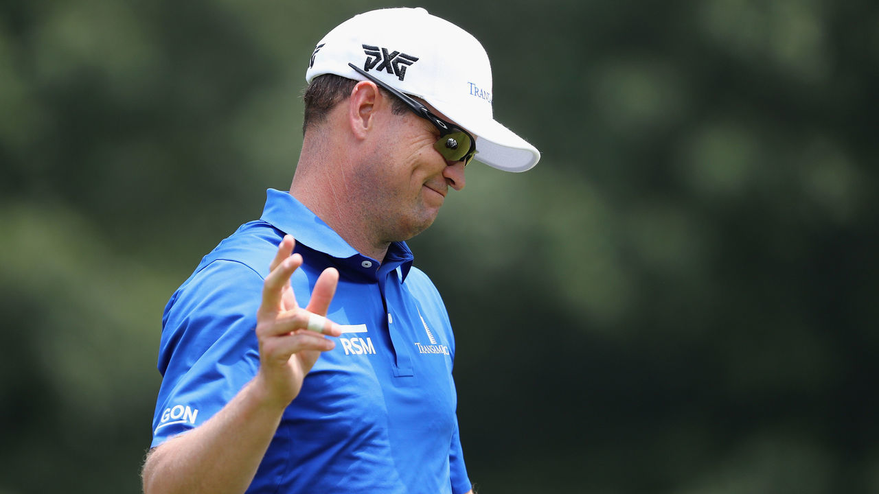 CROMWELL, CT - JUNE 24: Zach Johnson of the United States acknowledges the gallery after making a putt for birdie on the fourth green during the final round of the Travelers Championship at TPC River Highlands on June 24, 2018 in Cromwell, Connecticut.