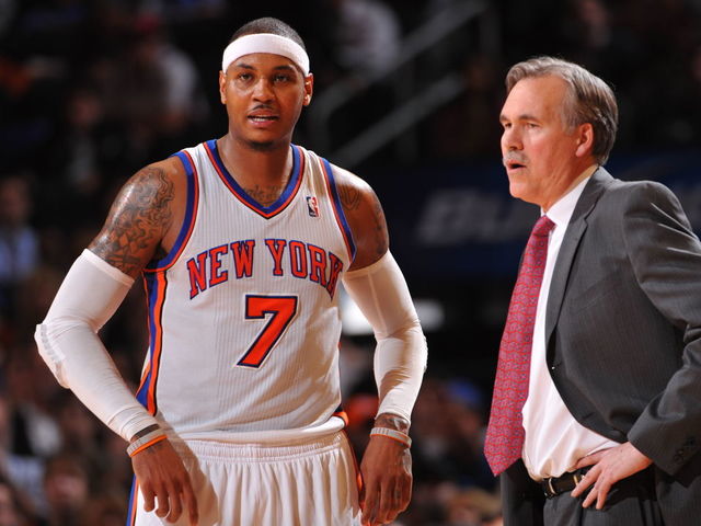 NEW YORK - JANUARY 11: Carmelo Anthony #7 of the New York Knicks talks to head coach Mike D'Antoni during the game against the Philadelphia 76ers on January 11, 2012 at Madison Square Garden in New York, New York. NOTE TO USER: User expressly acknowledges and agrees that, by downloading and/or using this Photograph, user is consenting to the terms and conditions of the Getty Images License Agreement. Mandatory Copyright Notice: Copyright 2012 NBAE