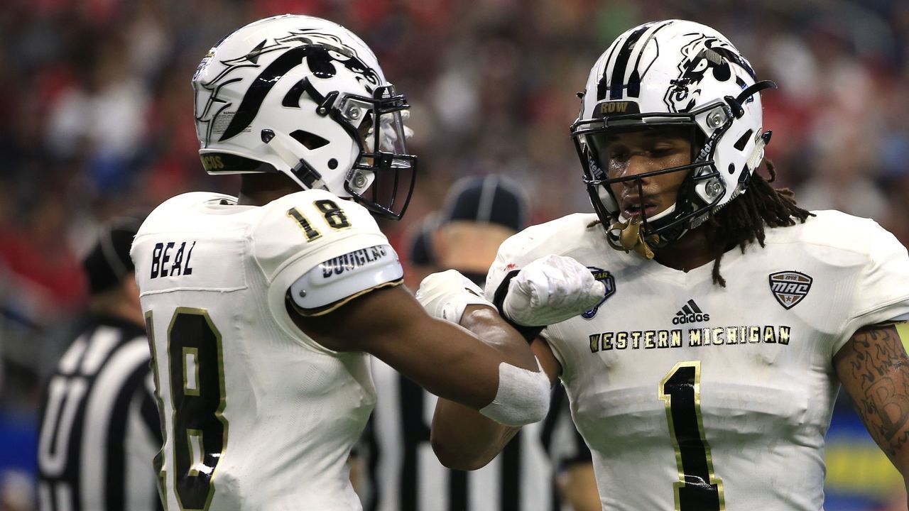 ARLINGTON, TX - JANUARY 2: Sam Beal #18 of the Western Michigan Broncos and teammate Keion Adams #1 react after stopping the Wisconsin Badgers from a first down during the first half of the 81st Goodyear Cotton Bowl at AT&T Stadium on January 2, 2017 in Arlington, Texas.