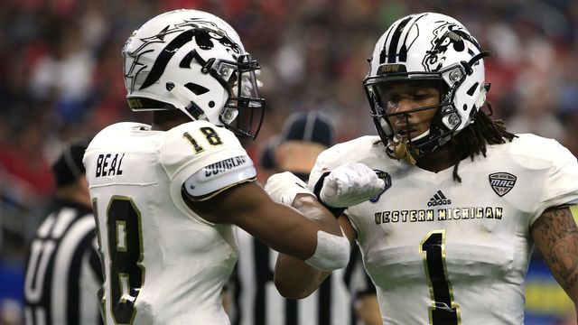 ARLINGTON, TX - JANUARY 2: Sam Beal #18 of the Western Michigan Broncos and teammate Keion Adams #1 react after stopping the Wisconsin Badgers from a first down during the first half of the 81st Goodyear Cotton Bowl at AT&T Stadium on January 2, 2017 in Arlington, Texas.
