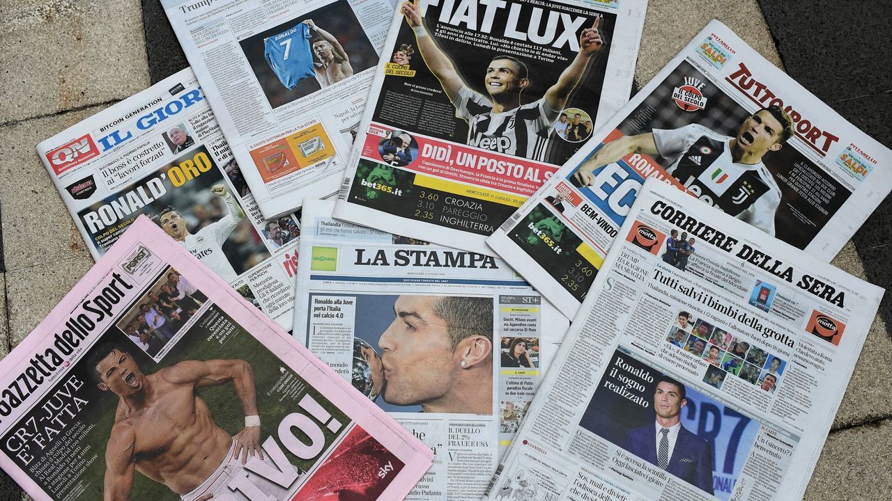 A picture taken on July 11, 2018 in Milan shows the Italian newspapers front pages enlightening the arrival of Portugal's Cristiano Ronaldo at the Italian Serie A football club Juventus Turin. - Ronaldo left Real Madrid to join Italian champions Juventus for 100 million euros ($117 million) on July 10, with the Portuguese superstar saying the time had come 'for a new stage' in his life. Juventus confirmed that Ronaldo had signed a four-year contract and that the transfer fee, including 12 million euros in add-ons, would be paid over two years, with Spanish media reporting he would receive a salary of 30 million euros a season.