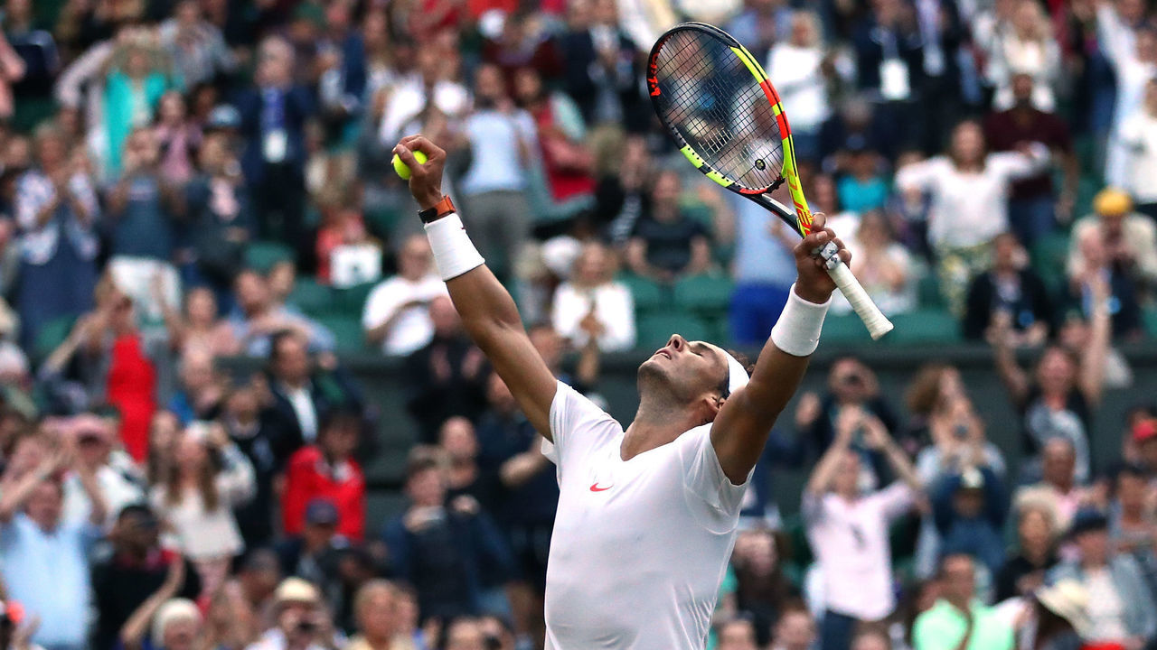 LONDON, ENGLAND - JULY 11: Rafael Nadal of Spain celebrates winning match point against Juan Martin Del Potro of Argentina during their Men's Singles Quarter-Finals match on day nine of the Wimbledon Lawn Tennis Championships at All England Lawn Tennis and Croquet Club on July 11, 2018 in London, England. Nadal won the match 5-7, 7-6, 6-4, 4-6, 4-6 in 4hr 47min.