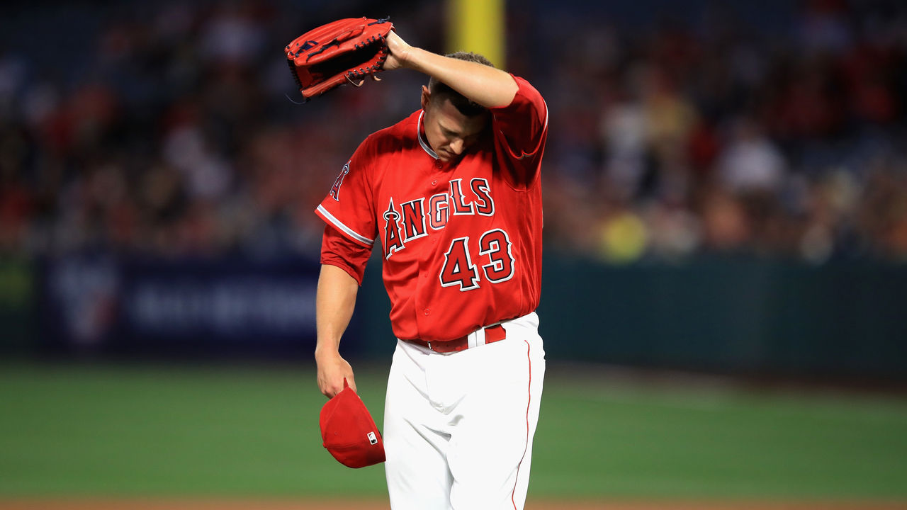 ANAHEIM, CA - APRIL 03: Garrett Richards #43 of the Los Angeles Angels of Anaheim wipes his head during the first inning of a game against the Cleveland Indians at Angel Stadium on April 3, 2018 in Anaheim, California.