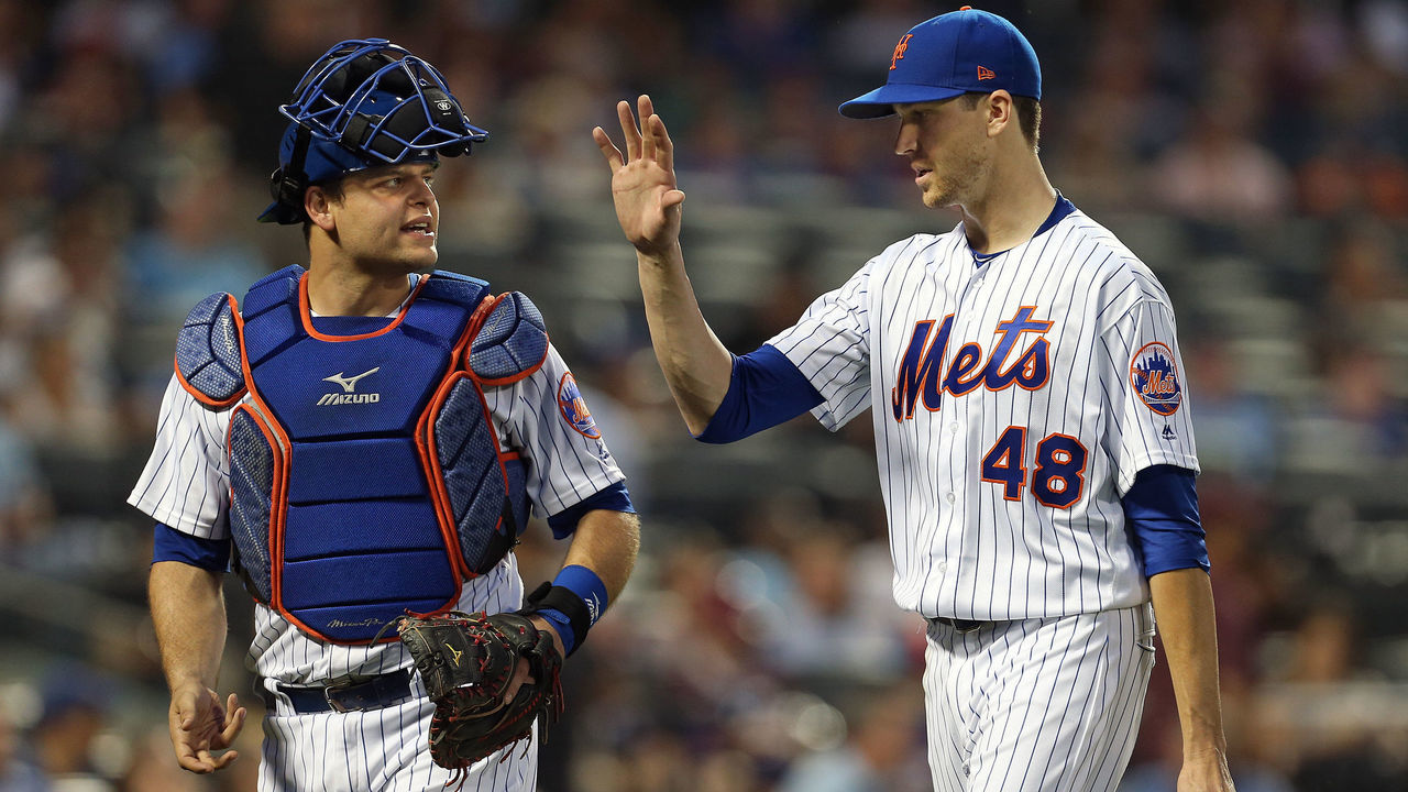 NEW YORK, NY - JULY 11: Catcher Devin Mesoraco #29 and pitcher Jacob deGrom #48 of the New York Mets talk at the end of the fifth inning of a game against the Philadelphia Phillies at Citi Field on July 11, 2018 in the Flushing neighborhood of the Queens borough of New York City. The Mets defeated the Phillies 3-0 in 10 innings.