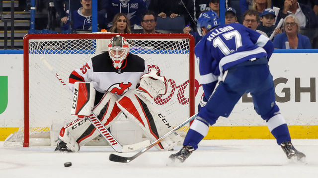 TAMPA, FL - APRIL 21: Cory Schneider #35 of the New Jersey Devils looks out as Alex Killorn #17 of the Tampa Bay Lightning approaches in the first period of Game Five of the Eastern Conference First Round during the 2018 NHL Stanley Cup Playoffs at Amalie Arena on April 21, 2018 in Tampa, Florida. *** Local Caption *** Alex Killorn;Cory Schneider