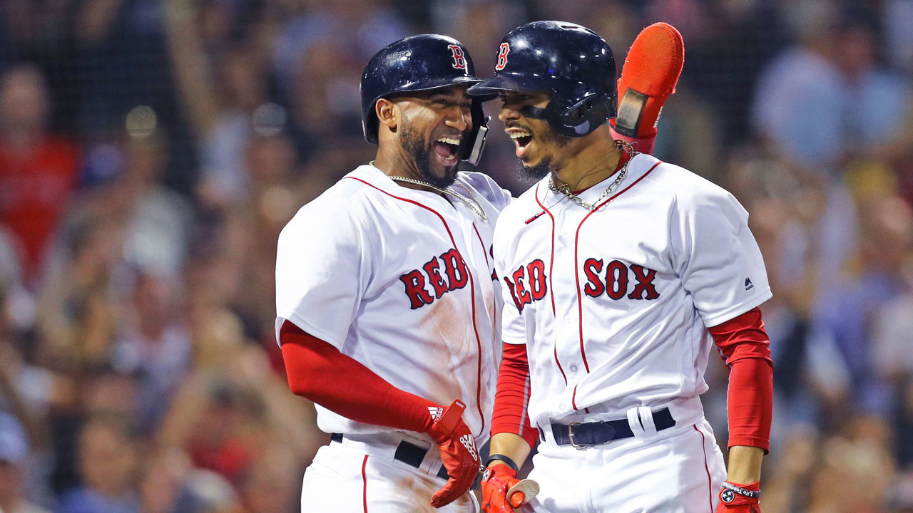 BOSTON, MA - JULY 12: Mookie Betts #50 of the Boston Red Sox celebrates with Eduardo Nunez #36 after hitting a grand slam against the Toronto Blue Jays during the fourth inning at Fenway Park on July 12, 2018 in Boston, Massachusetts.