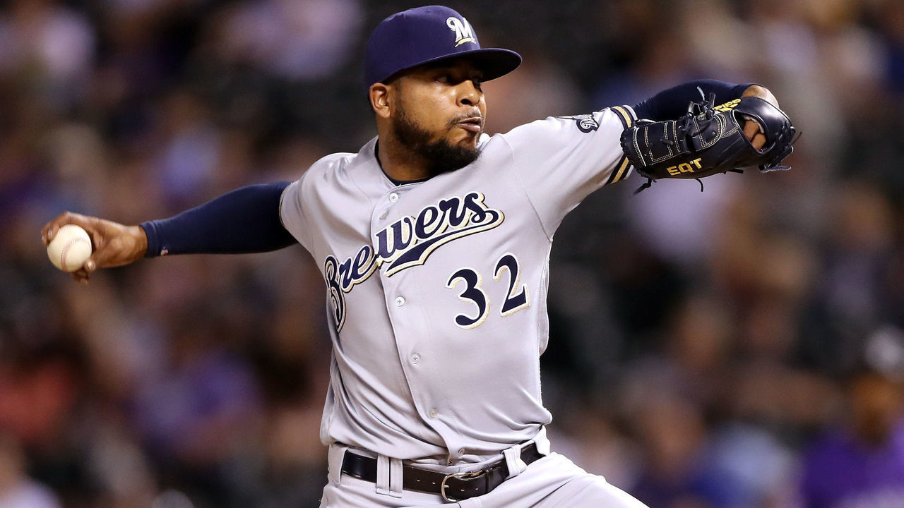DENVER, CO - MAY 10: Pitcher Jeremy Jeffress #32 of the Milwaukee Brewers throws in the ninth inning against the Colorado Rockies at Coors Field on May 10, 2018 in Denver, Colorado.