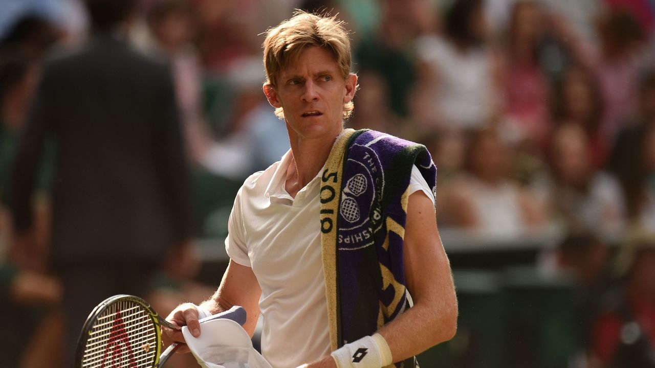 TOPSHOT - South Africa's Kevin Anderson reacts against US player John Isner during the final set tie-break of their men's singles semi-final match on the eleventh day of the 2018 Wimbledon Championships at The All England Lawn Tennis Club in Wimbledon, southwest London, on July 13, 2018.