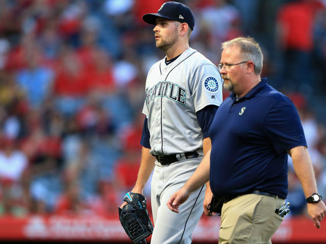 ANAHEIM, CA - JULY 12: James Paxton #65 of the Seattle Mariners leaves the game after allowing two homeruns during the first inning of a game against the Los Angeles Angels of Anaheim at Angel Stadium on July 12, 2018 in Anaheim, California.