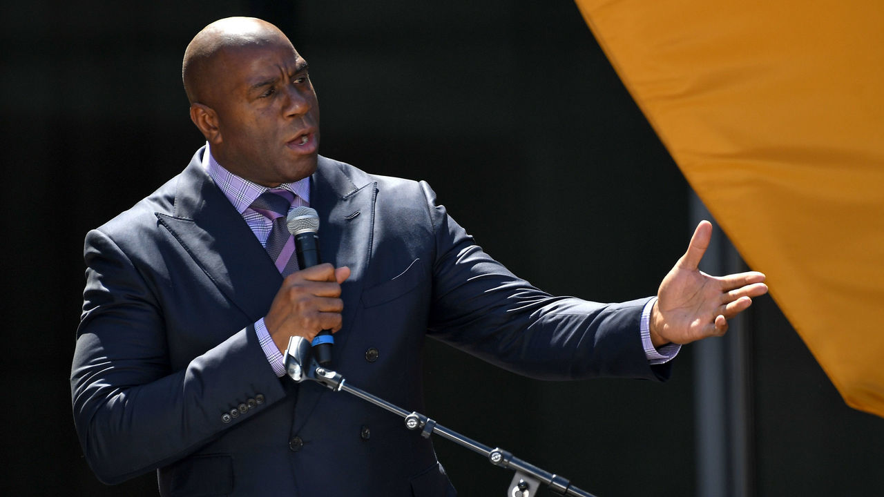 LOS ANGELES, CA - APRIL 18: Co-owner Magic Johnson of the Los Angeles FC speaks to fans and media at the ribbon cutting ceremony for the new Banc of California Stadium on April 18, 2018 in Los Angeles, California.