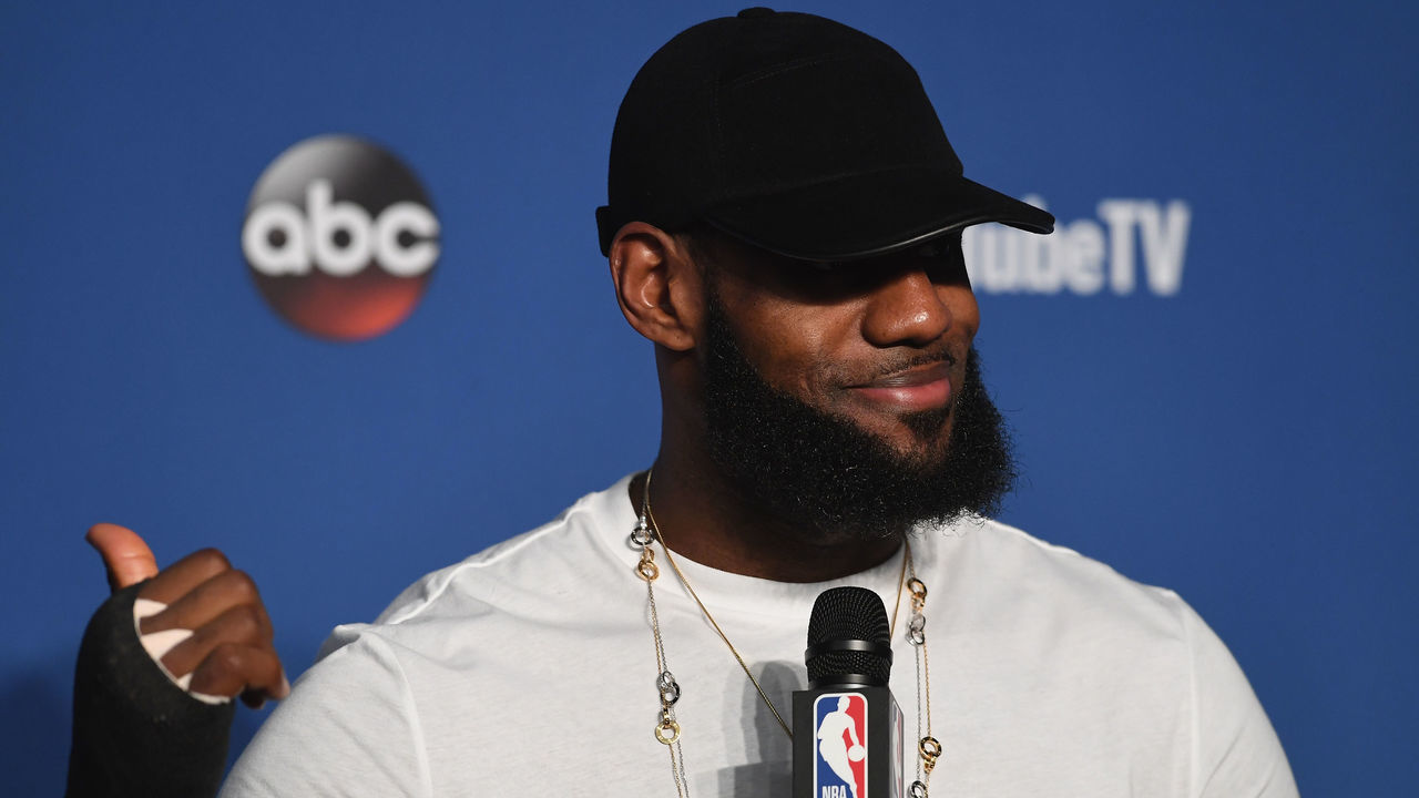 CLEVELAND, OH - JUNE 08: LeBron James #23 of the Cleveland Cavaliers speaks to the media with a cast on his right hand after being defeated by the Golden State Warriors during Game Four of the 2018 NBA Finals at Quicken Loans Arena on June 8, 2018 in Cleveland, Ohio. The Warriors defeated the Cavaliers 108-85 to win the 2018 NBA Finals.