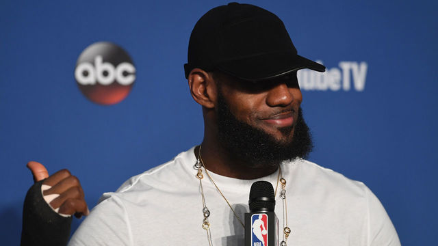 CLEVELAND, OH - JUNE 08: LeBron James #23 of the Cleveland Cavaliers speaks to the media with a cast on his right hand after being defeated by the Golden State Warriors during Game Four of the 2018 NBA Finals at Quicken Loans Arena on June 8, 2018 in Cleveland, Ohio. The Warriors defeated the Cavaliers 108-85 to win the 2018 NBA Finals.