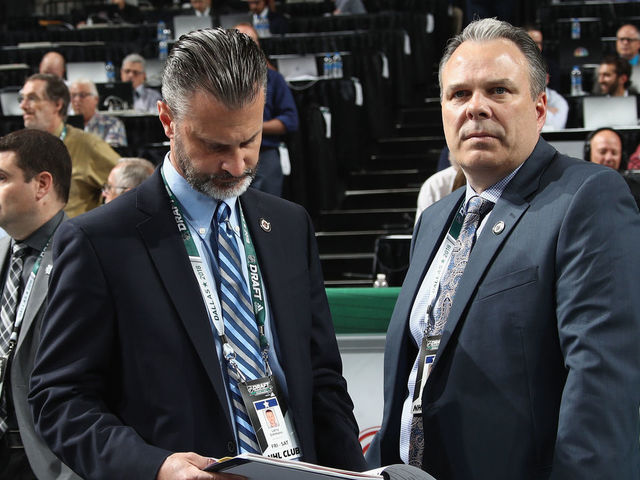 DALLAS, TX - JUNE 22: (l-r) Larry Simons and Kevin Cheveldayoff of the Winnipeg Jets attend the first round during the first round Airlines Center on June 22, 2018 in Dallas, Texas.