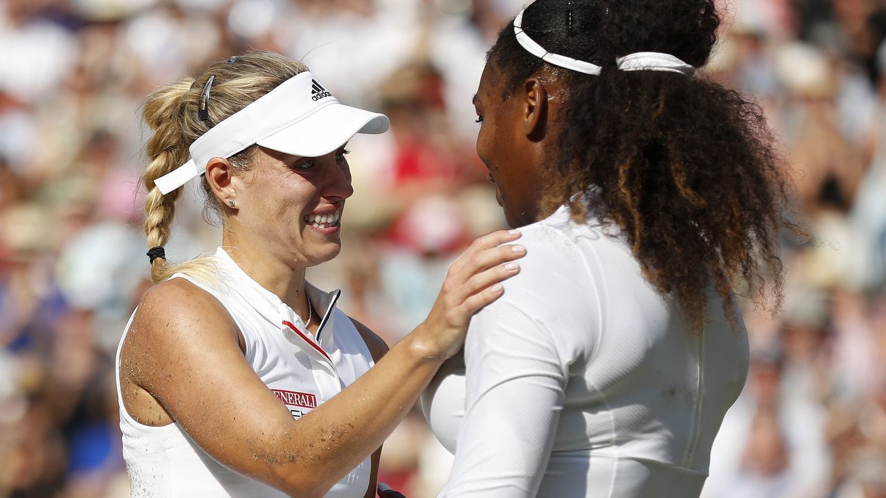 Germany's Angelique Kerber (L) embraces US player Serena Williams following their women's singles final match on the twelfth day of the 2018 Wimbledon Championships at The All England Lawn Tennis Club in Wimbledon, southwest London, on July 14, 2018. - Kerber won the match 6-3, 6-3.