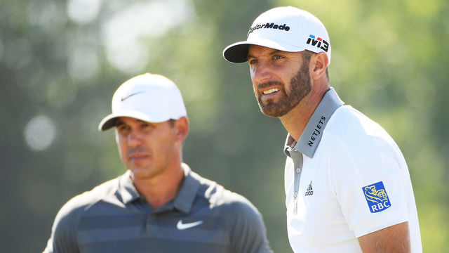 SOUTHAMPTON, NY - JUNE 17: Brooks Koepka of the United States (L) and Dustin Johnson of the United States (R) look on from the ninth tee during the final round of the 2018 U.S. Open at Shinnecock Hills Golf Club on June 17, 2018 in Southampton, New York.