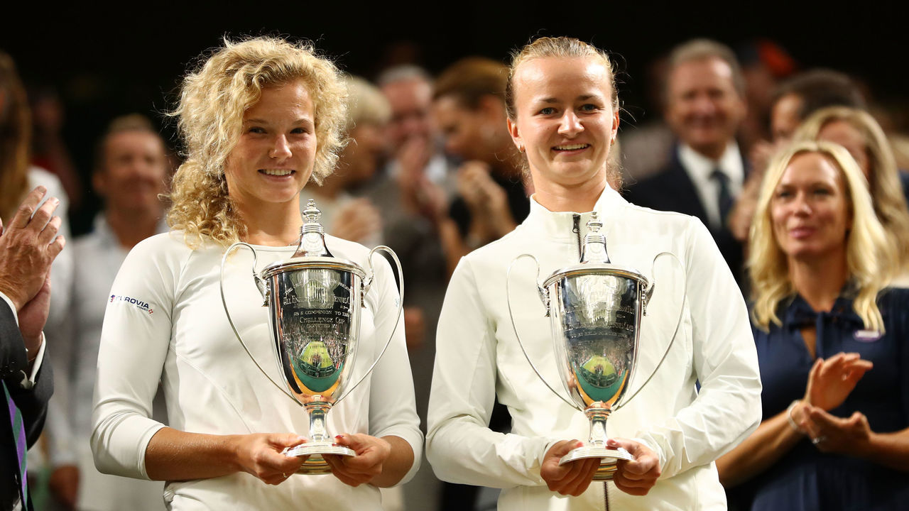 LONDON, ENGLAND - JULY 14: Winners Barbora Krejcikova (L) and Katerina Siniakova of Czech Republic pose with their trophies inside Centre Court after their victory against Nicole Melichar of The United States and Kveta Peschke of Czech Republic in the Ladies' Doubles final on day twelve of the Wimbledon Lawn Tennis Championships at All England Lawn Tennis and Croquet Club on July 14, 2018 in London, England.